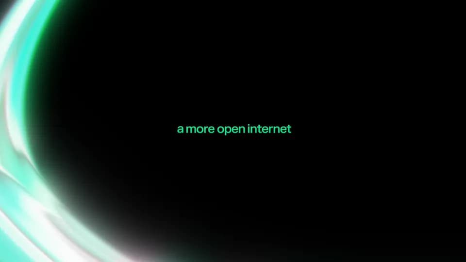 Frame from the NEAR campaign film: green text "a more open internet" on black with a glowing aqua curve at the left edge