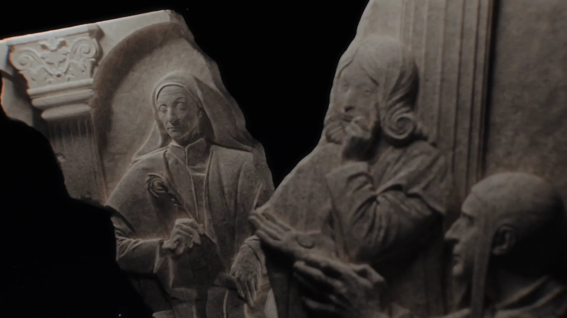 Forum brand identity: carved stone relief fragment of robed figures in profile standing next to columns, lit against black