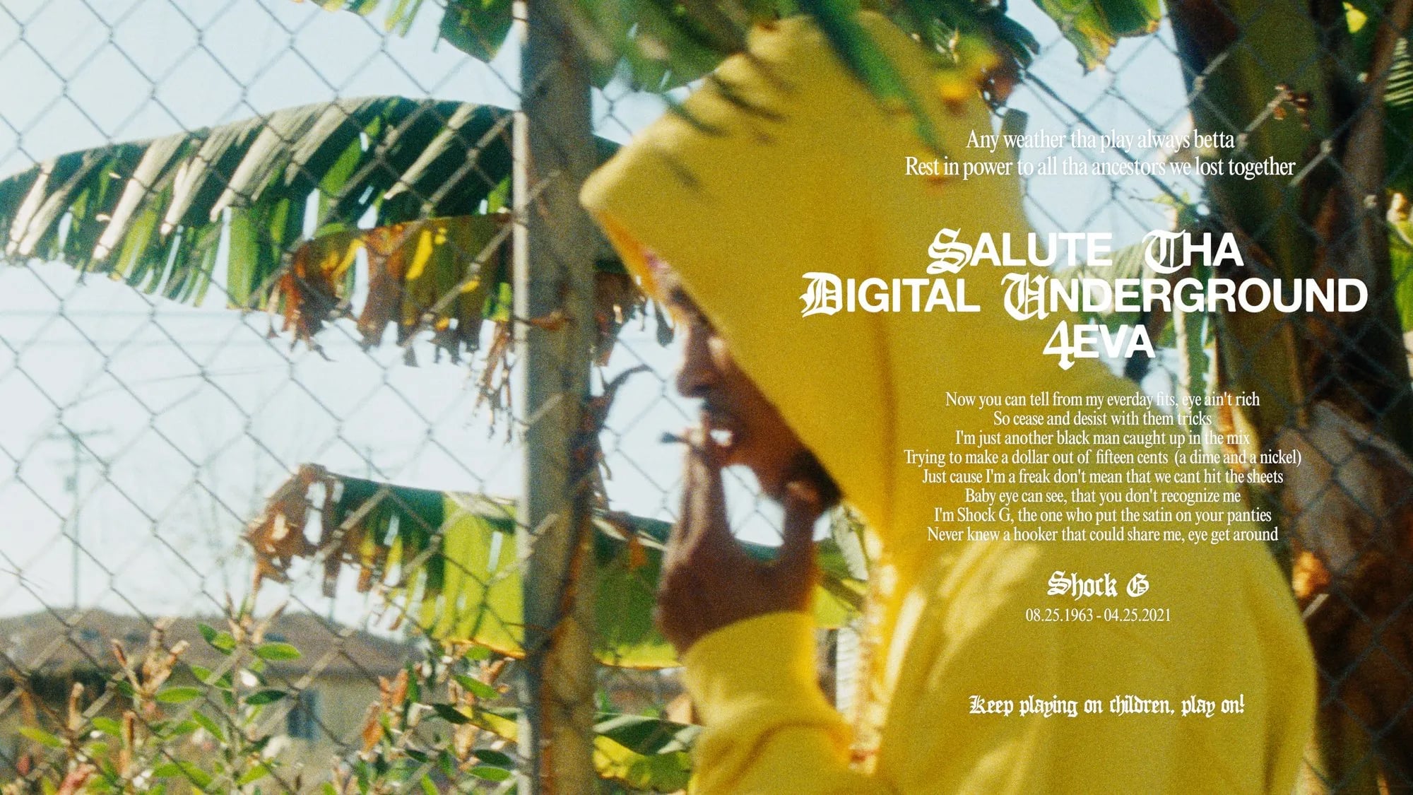 Pink Siifu video frame: man in a yellow hoodie by a chain-link fence, title "Salute Tha Digital Underground 4eva"